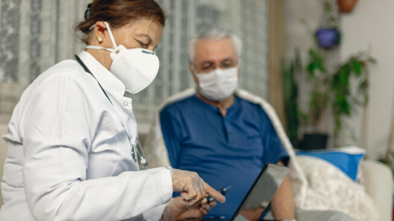 Doctor Consulting With Patient